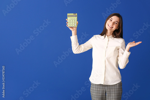 Young woman with calculator...