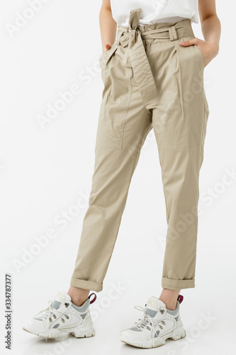 young girl in pastel trousers