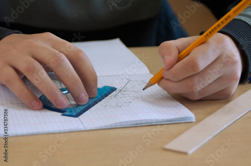 the student draws a task on descriptive geometry