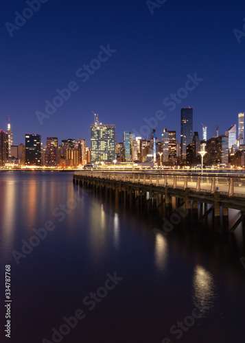 View on Midtown Manhattan from East river pier during the blue hour with long exposure