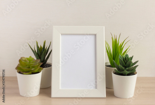 An empty photo frame on a table or shelf with a copy of the space © Елена Николаева