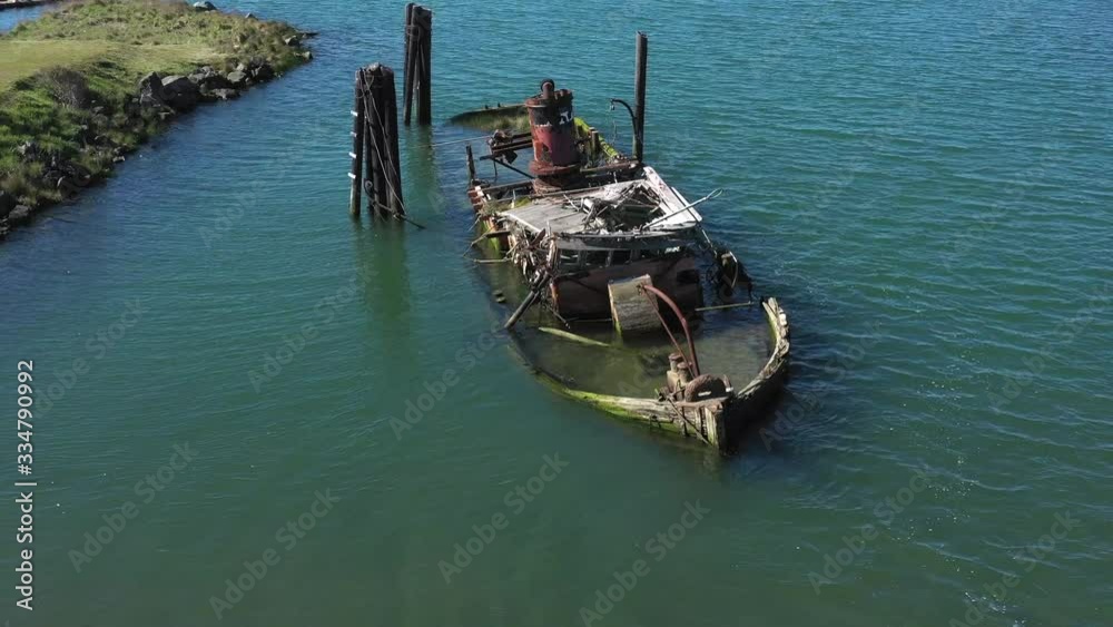 A steamer build in 1881 in Gold Beach now resting in peace in the Rouge River where it sank in 1985 now an important piece of culture and history and a valuable landmark in Gold Beach, Oregon A steamer build in 1881 in Gold Beach now resting in peace in the Rouge River where it sank in 1985 now an important piece of culture and history and a valuable landmark in Gold Beach, Oregon