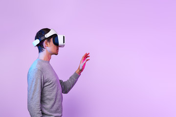 Man is using virtual reality headset.