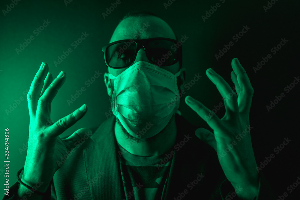 A young Caucasian man with scarf very scared in the coronavirus pandemic, Covid-19 A young Caucasian man with scarf very scared in the coronavirus pandemic, Covid-19