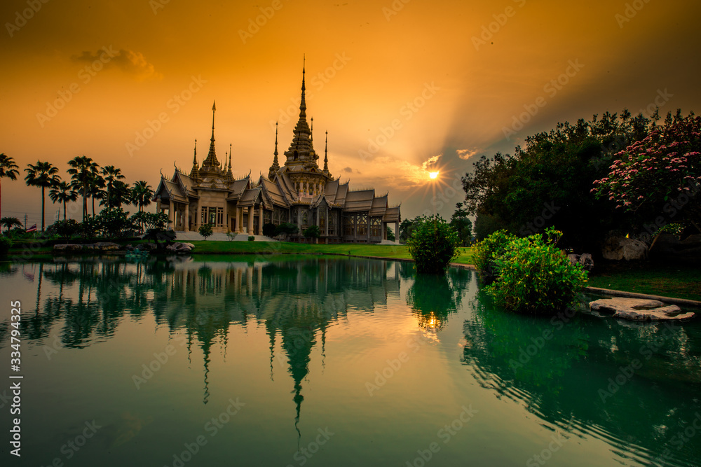 Obraz premium Wallpaper Wat Lan Boon Mahawihan Somdet Phra Buddhacharn(Wat Non Kum)is the beauty of the church that reflects the surface of the water, popular tourists come to make merit and take a public photo