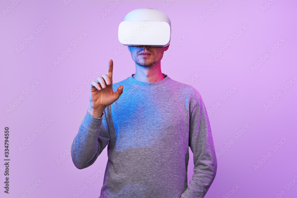 Man is using virtual reality headset. Man is using virtual reality headset.