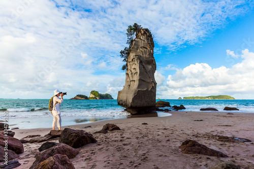 Cathedral Cove. Woman taking pictures