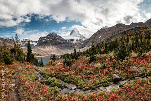 Mount Assiniboine with Lake Magog on Autumn forest at provincial park photo