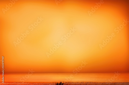 Orange table top on an orange background