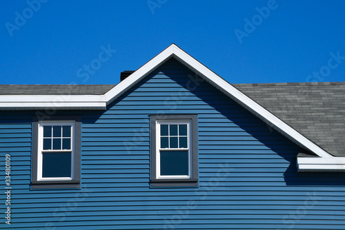 house facade blue wooden home property family traditional architecture roof