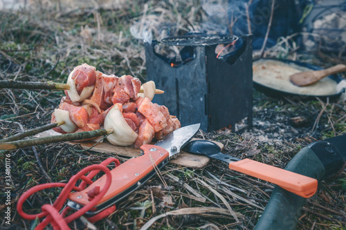 Cooking while hiking with a backpack.