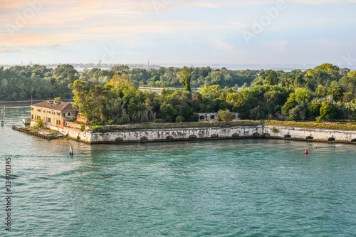 The sun begins to set on Forte Sant'Andrea on the island of Le Vignole, in the waters off of Venice, Italy.