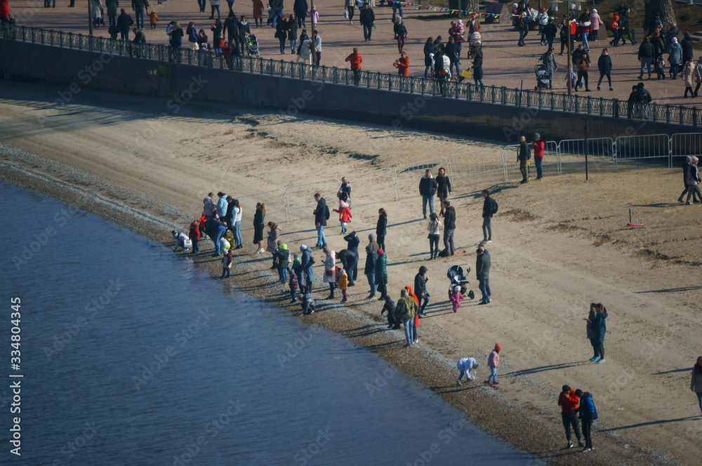 People celebrate the holiday on the city's embankment.