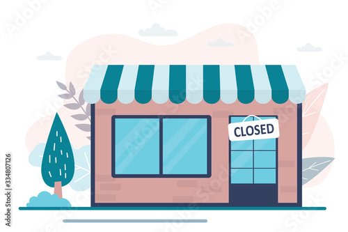 Shop closed. Empty storefront and plate on the door, the store is not working. Nobody on street.