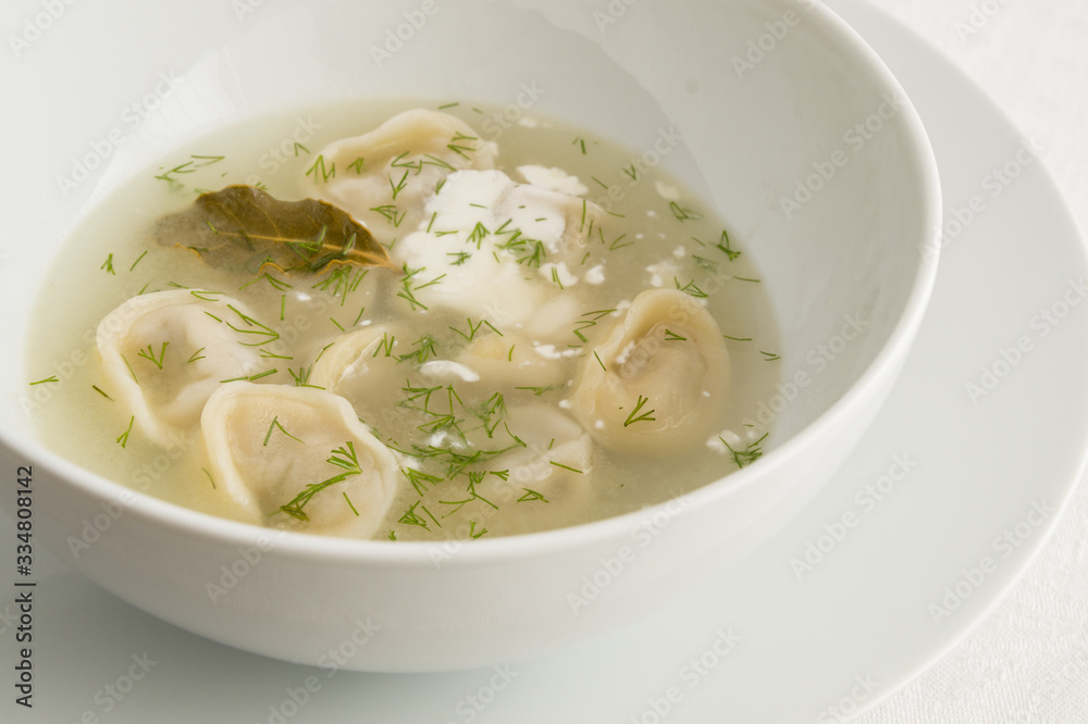 pelmeni in broth with dill and sour cream pelmeni in broth with dill and sour cream