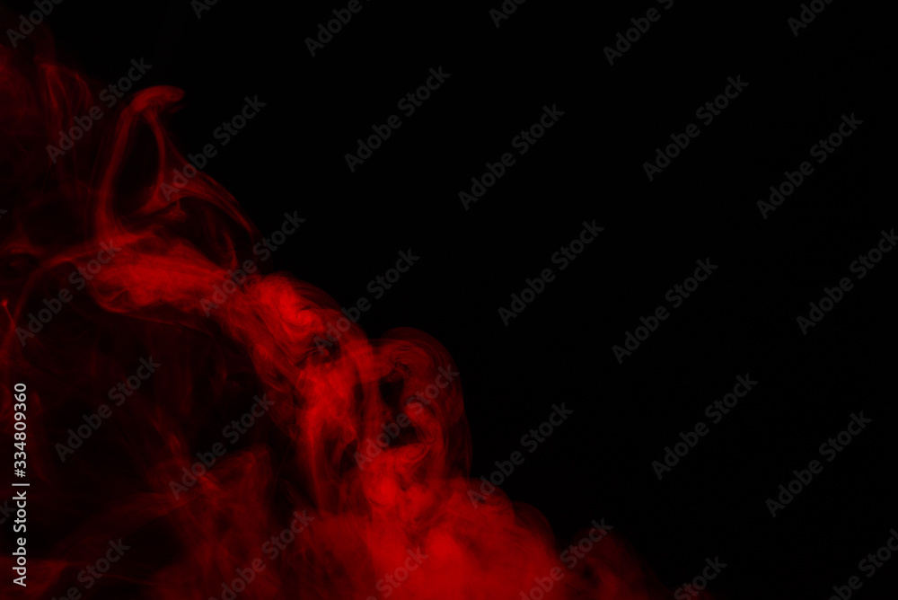 Fototapeta premium Red steam on a black background.