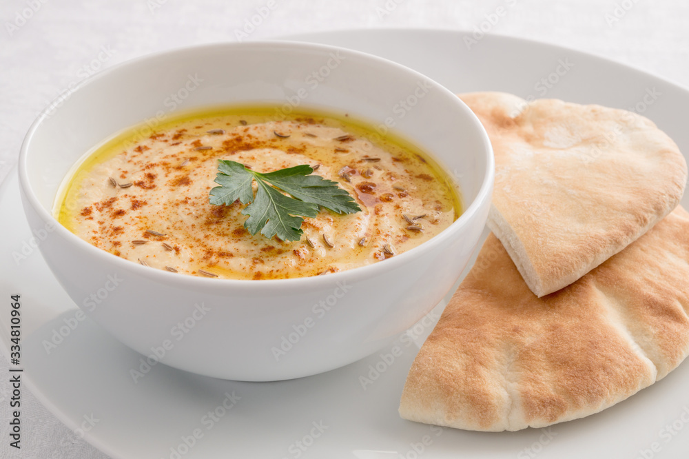 hummus decorated with chickpeas served with pita hummus decorated with chickpeas served with pita