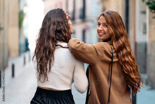 Two caucasian women in the street