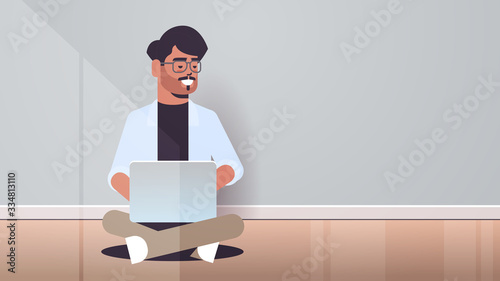 indian man sitting lotus pose using laptop guy working from home freelance concept modern room interior horizontal full length vector illustration