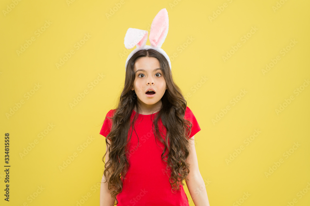 Are you ready to celebrate. Kid on Easter egg hunt. teen kid in rabbit costume having fun. happy easter. small girl wearing bunny ears. surprised child in costume. Easter bunny rabbit with ears