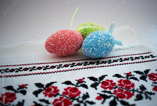 Easter eggs and towel on a white background