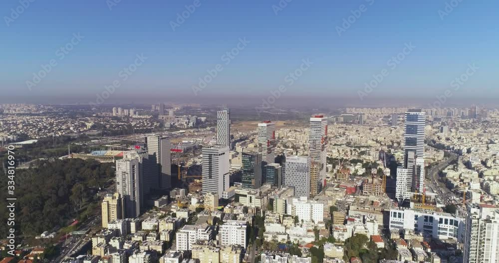 Aerial view of Tel aviv skyline. Urban landscape at daytime with skyscraper view and Sea water in horizon Aerial view of Tel aviv skyline. Urban landscape at daytime with skyscraper view and Sea water in horizon