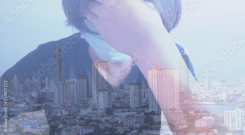 double exposure Asian men with black shirts are wearing masks and city scape view, healthcare and medical, corona virus or covid-19 healthcare concept