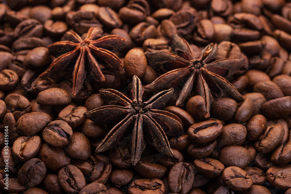 stars anise against the background of coffee beans stars anise against the background of coffee beans