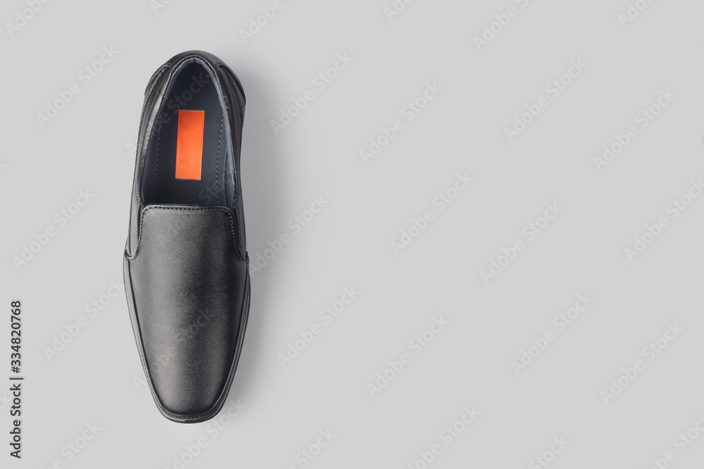 Black leather elegant shoes on gray background Black leather elegant shoes on gray background