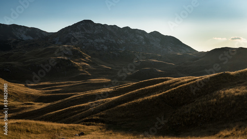 Playing light and shadows on a summer evening on the mountain plateau of Durmitor Park