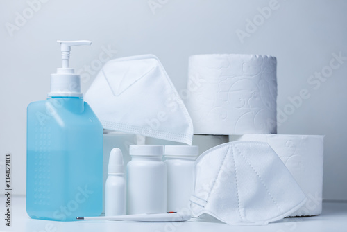 Hand sanitizer and face masks on store shelf hospital supplies for corona virus