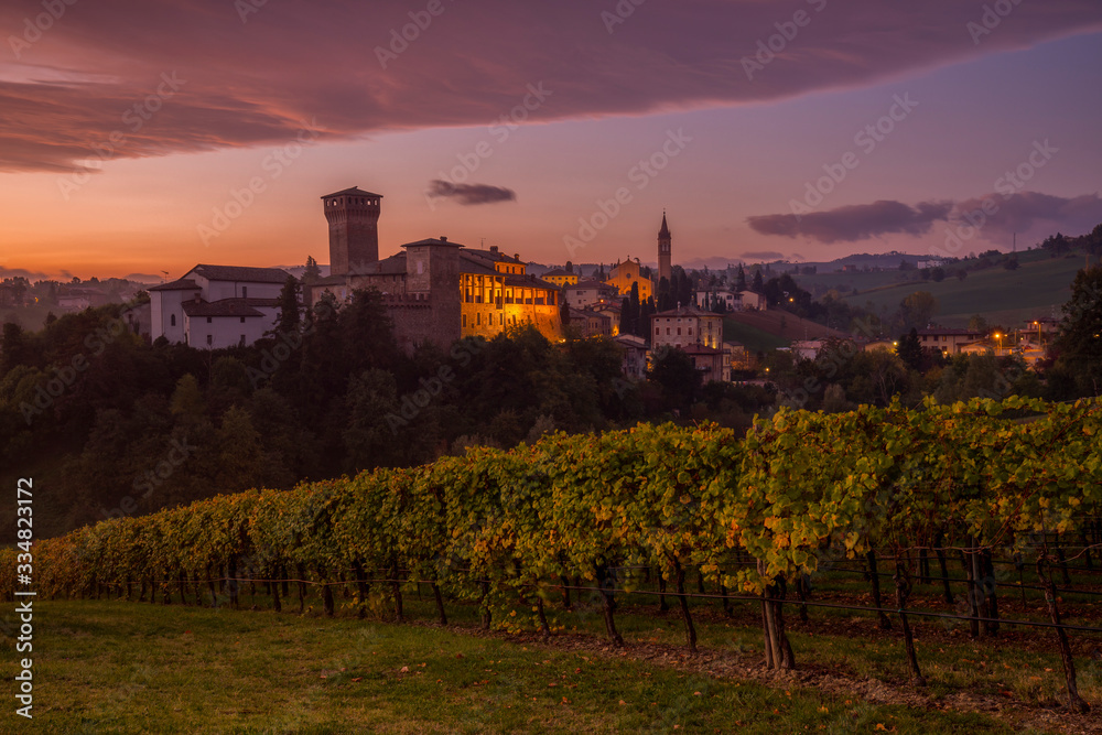 Levizzano di Castelvetro at sunrise with vineyards in autumn, Emilia Romagna, Italy