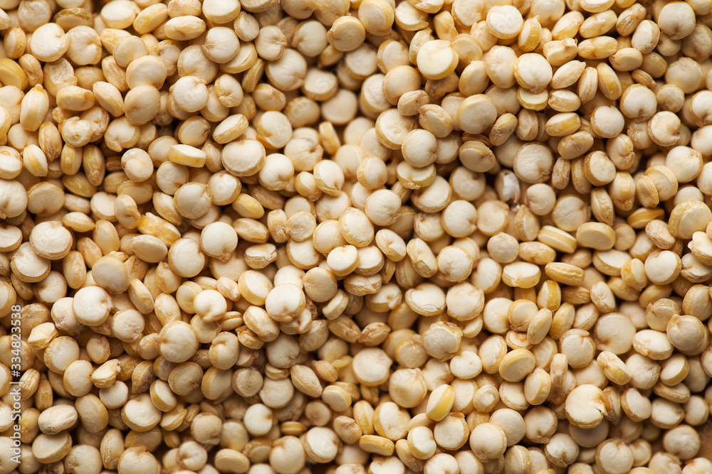 Dry quinoa croup closeup in full frame. Quinoa photo for recipes, grocery departments, logo. Quinoa photo wallpaper. Dry quinoa croup closeup in full frame. Quinoa photo for recipes, grocery departments, logo. Quinoa photo wallpaper.