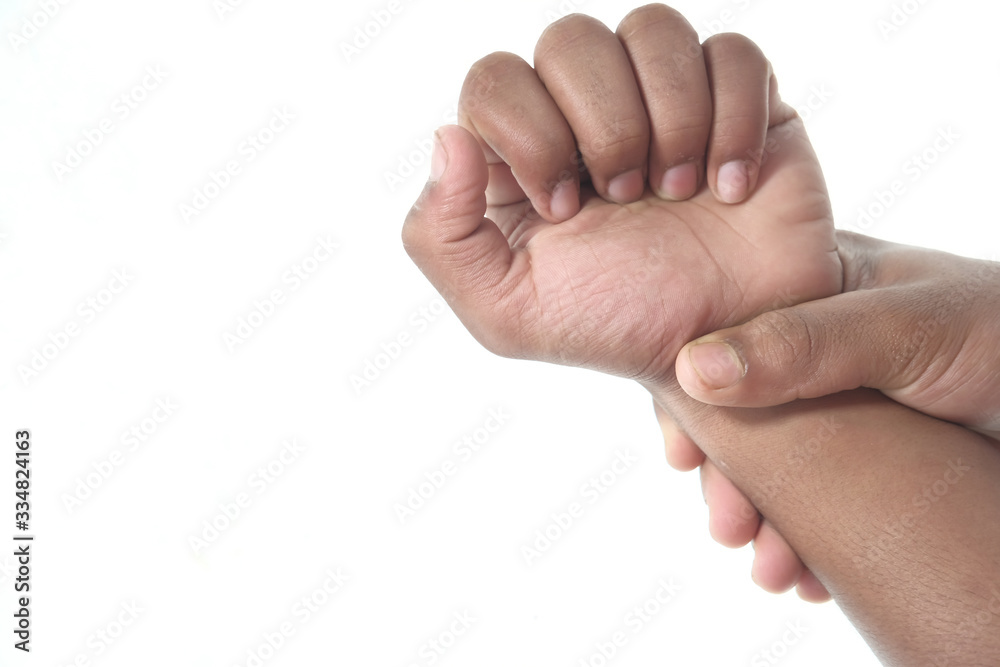Close up man holding her wrist symptomatic Office Syndrome. Close up man holding her wrist symptomatic Office Syndrome.