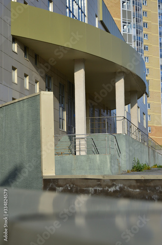 beige building with a porch on the pillars photo