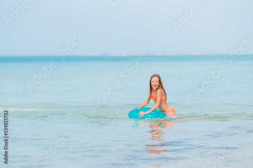 Cute little girl at beach during caribbean vacation