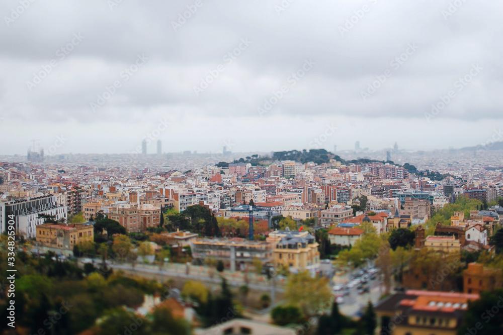 Panoramic view from the roof of a house on the city of Barcelona, Spain. Traveling Europe. Cloudy day. Spanish architectural background