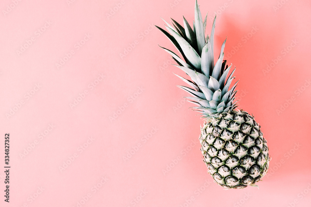 Summer minimal composition. Creative layout made of pineapple on pastel pink background. Flat lay, top view, copy space
