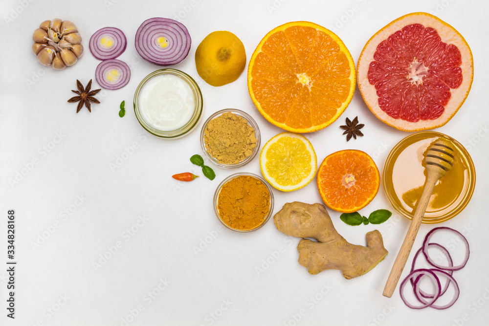 Naklejka Set of products of citrus, ginger, honey, garlic, onions yogurt for natural protection against the virus