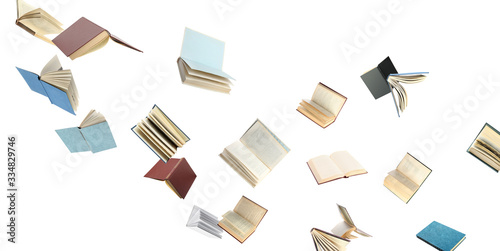 Old hardcover books flying on white background