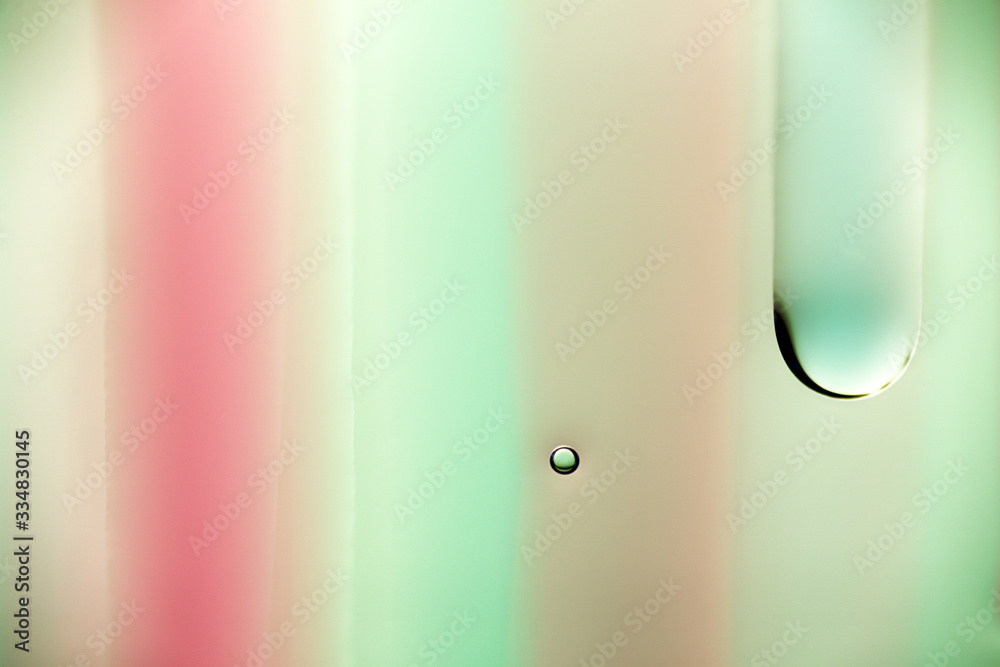 Slowly dripping green and red transparent liquid. Slowly dripping green and red transparent liquid.