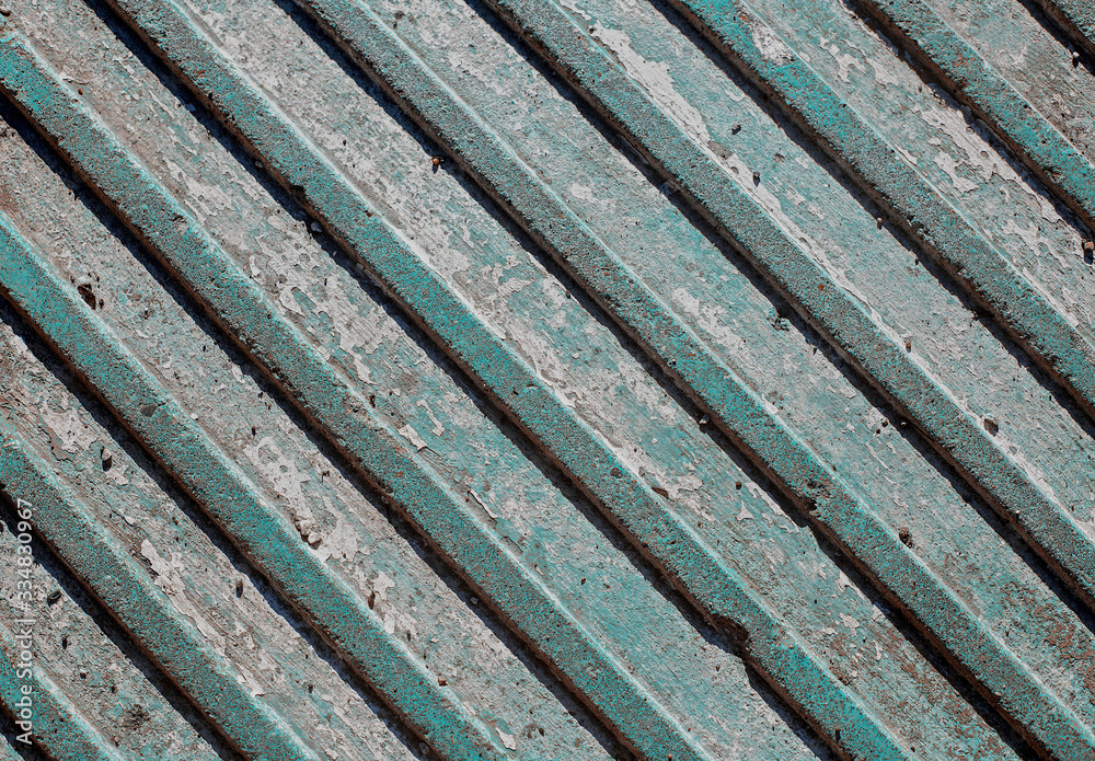 Texture of grunge tile with volumetric diagonal stripes in aqua menthe color. Teal worn floor with diagonal lines
