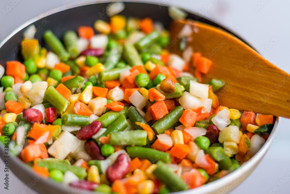 Mixed vegetables in a frying pan Mixed vegetables in a frying pan