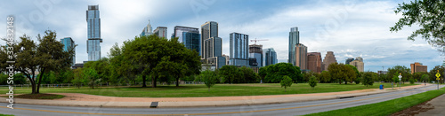 Panoramic View of Downtown Austin Skyline from Riverside Dr Street with Mostly Clear Skies © porqueno