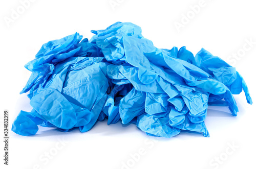 many blue medical gloves isolated on white background. Means of protection against viruses and germs.