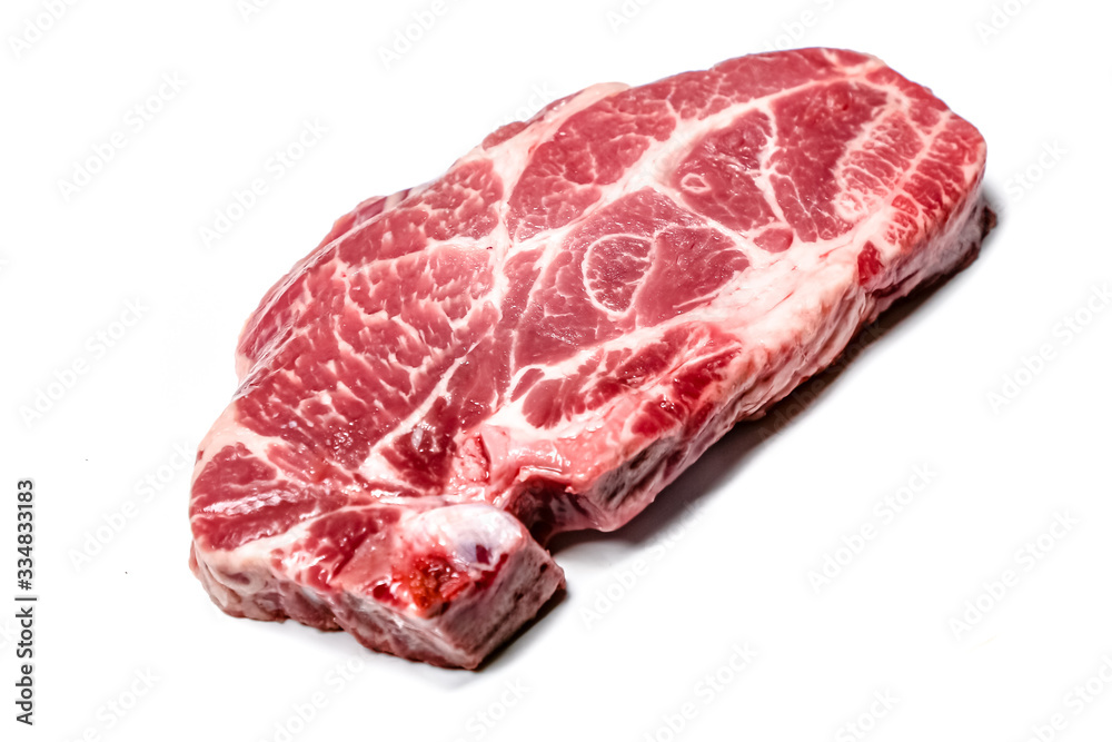 Raw pork neck tenderloin steak lies on a white background. Isolated