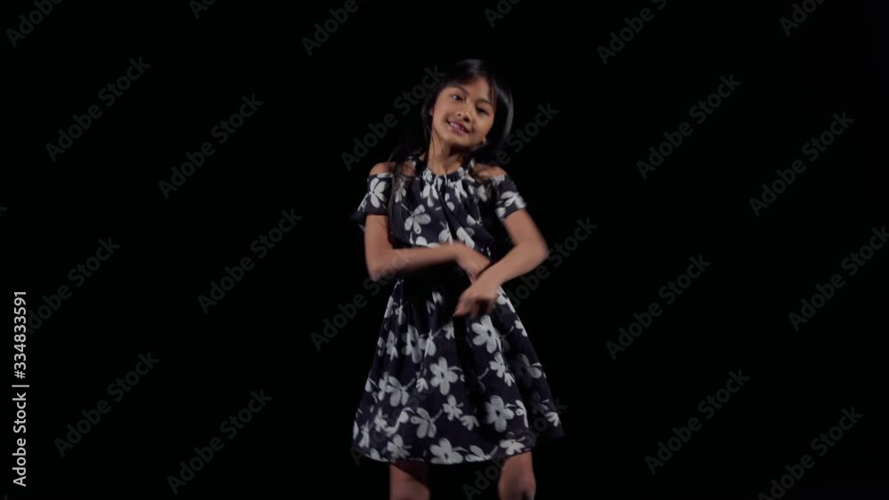 A little asian girl dances foxtrot style A little asian girl dances foxtrot style