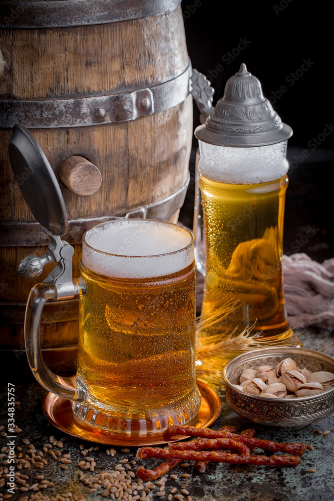 Light beer in a glass, on an old background. Light beer in a glass, on an old background.