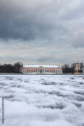 Manor Palace in Kuskovo in winter, Moscow, Russia, view across the pond. Travel around Russia in winter season.