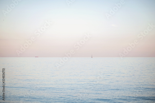 Transparent sea water and a beautiful blue sky. The sea scenery.